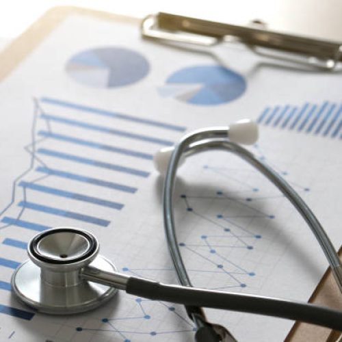 financial report chart and calculator Medical Report and stethoscope