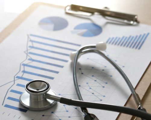 financial report chart and calculator Medical Report and stethoscope