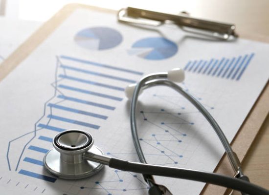 financial report chart and calculator Medical Report and stethoscope